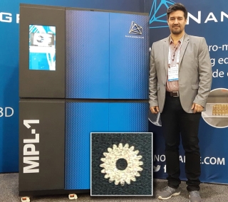 Company CEO Juan Schneider stands by the MPL-1 printer used to build the gear. 